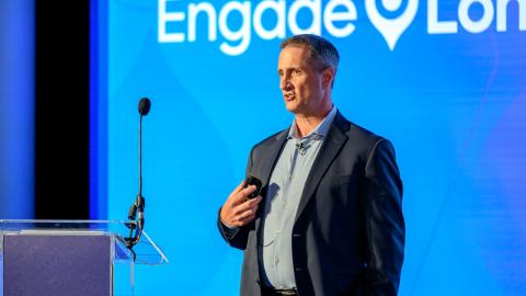 Speakers at an Acquia engage event presenting on stage